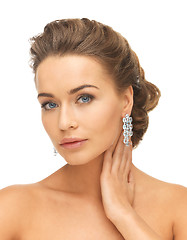 Image showing woman wearing shiny diamond earrings