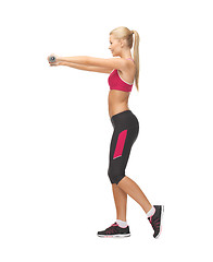 Image showing young sporty woman with light dumbbells