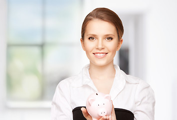 Image showing lovely woman with piggy bank