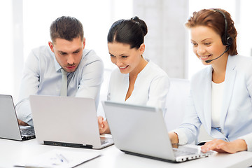 Image showing group of people working with laptops in office