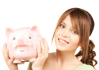 Image showing lovely girl with big piggy bank