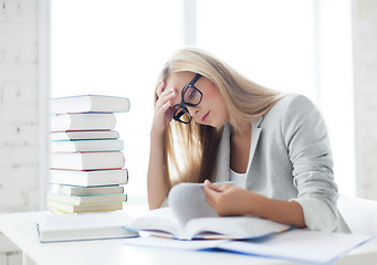 Image showing student with books and notes