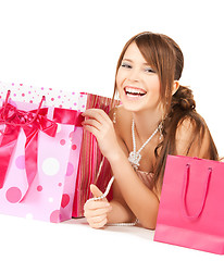 Image showing girl with colorful gift bags