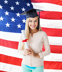 Image showing student in graduation cap with certificate