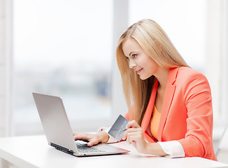 Image showing businesswoman with laptop and credit card