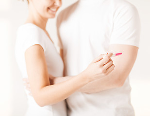 Image showing woman and man hands with pregnancy test