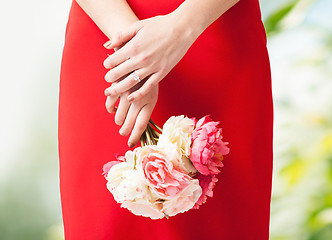 Image showing woman hands with flowers and ring