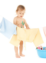 Image showing baby doing laundry