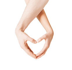 Image showing woman and man hands showing heart shape
