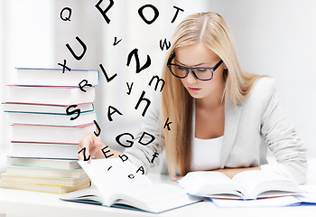 Image showing student with books and notes