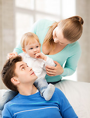 Image showing happy parents playing with adorable baby