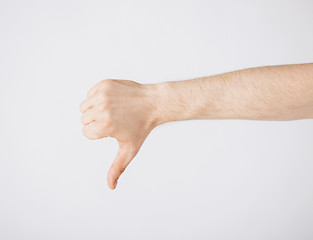 Image showing man showing thumbs down