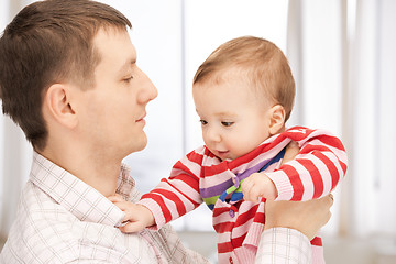 Image showing happy father with adorable baby