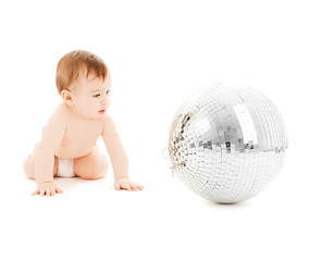 Image showing child playing with disco ball