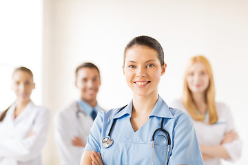 Image showing female doctor in front of medical group