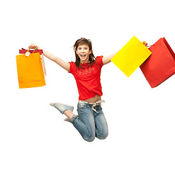 Image showing excited girl with shopping bags