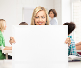 Image showing woman with white blank board at school