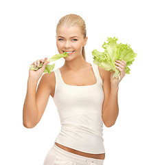 Image showing woman biting lettuce