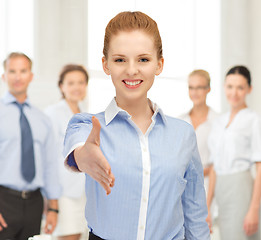 Image showing woman with an open hand ready for handshake