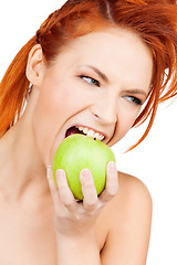 Image showing woman biting green apple