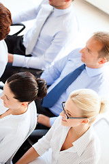 Image showing businessmen and businesswomen on conference