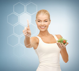Image showing woman with salad and virtual screen