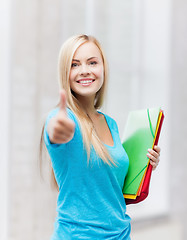 Image showing smiling student with folders