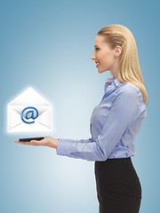 Image showing woman showing virtual envelope