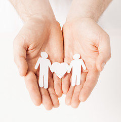 Image showing man hands with paper men