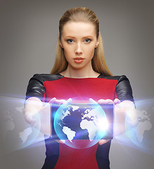 Image showing futuristic woman with tablet pc