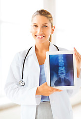 Image showing female doctor with x-ray on tablet pc