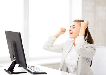 Image showing businesswoman with computer in office