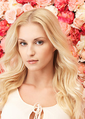 Image showing woman with  background full of roses