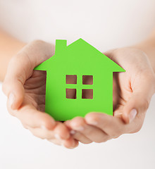 Image showing woman hands holding green house