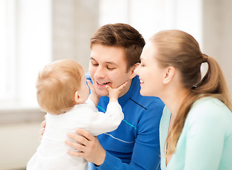 Image showing happy parents playing with adorable baby