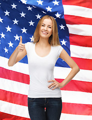 Image showing teenage girl in blank white t-shirt with thumbs up