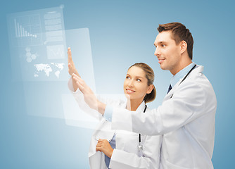 Image showing two doctors working with virtual screen