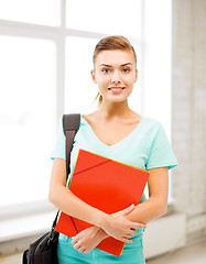 Image showing student girl with school bag and color folders