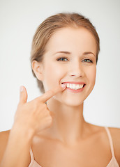 Image showing woman showing her teeth