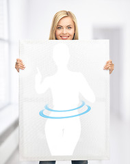 Image showing woman holding picture of dieting woman