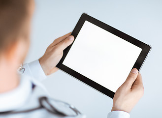 Image showing male doctor holding tablet pc