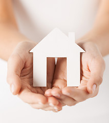 Image showing woman hands holding paper house