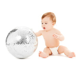 Image showing child playing with disco ball