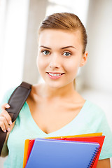 Image showing student girl with school bag and color folders