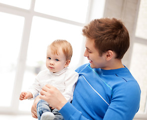 Image showing happy father with adorable baby