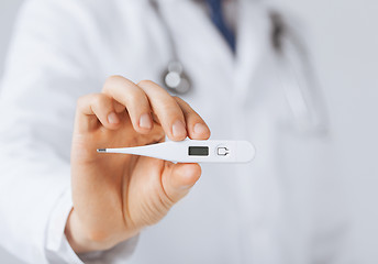 Image showing male doctor with thermometer