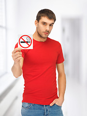 Image showing man in red shirt with no smoking sign