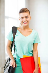 Image showing student girl with school bag and color folders