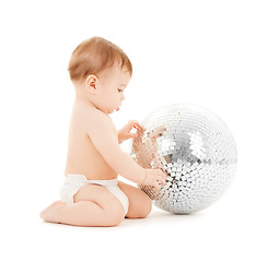 Image showing child playing with disco ball