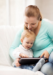 Image showing mother and adorable baby with tablet pc